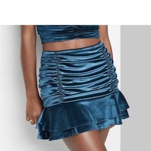 Velvet ruched mini skirt.